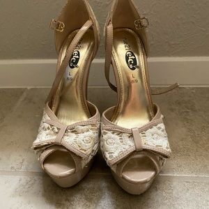 Nude lace pumps